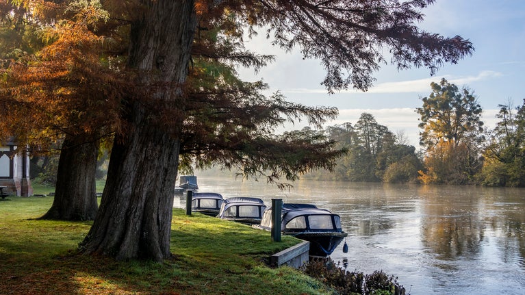 View of the boats on the river thames in the autumn at Cliveden, Buckinghamshire.